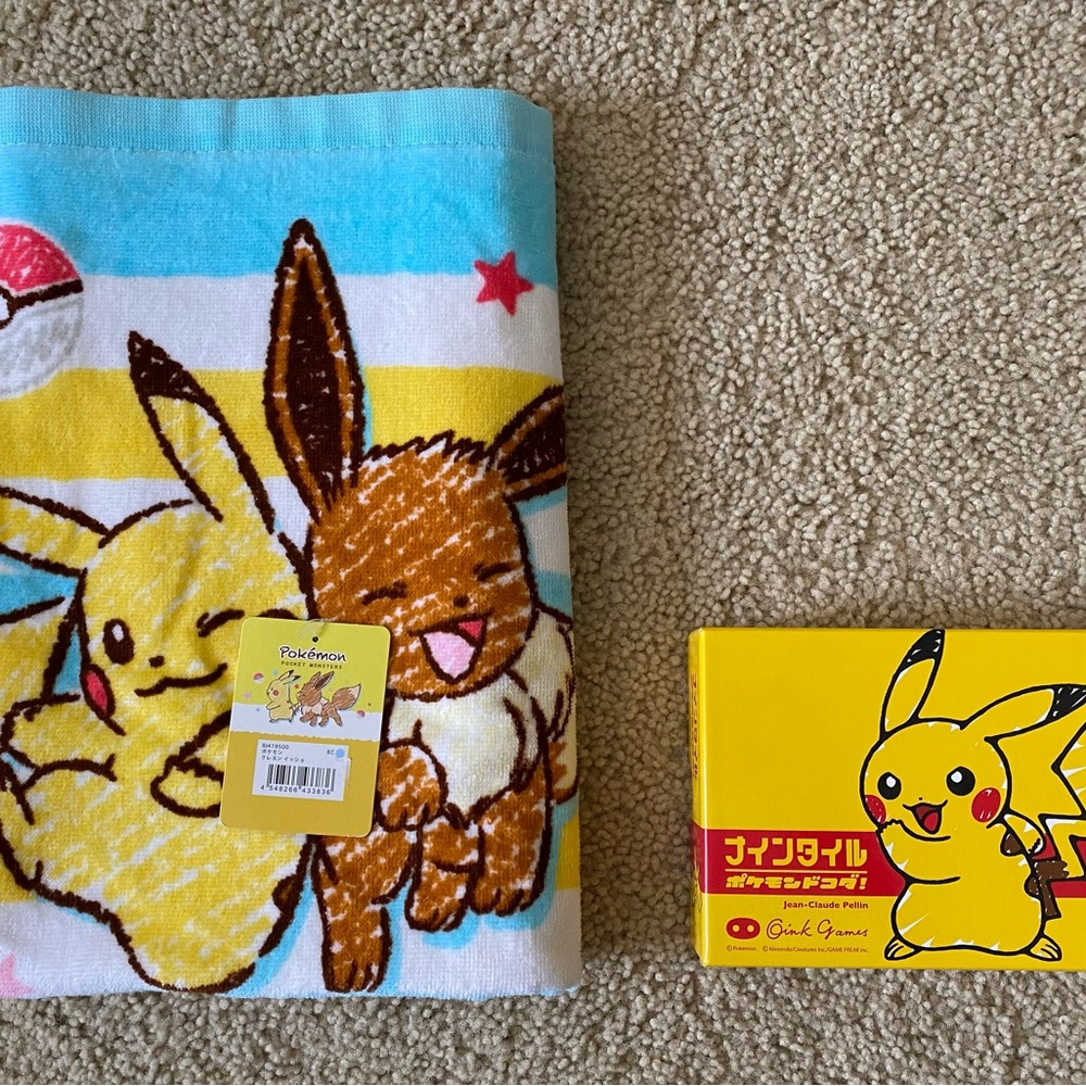 Pokémon bath towel and card game with bilingual instruction